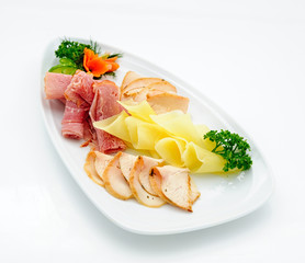 Cheese and meat plate studio shot.