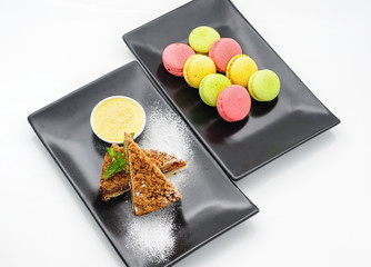Macaroons and blueberry cheesecake studio shot