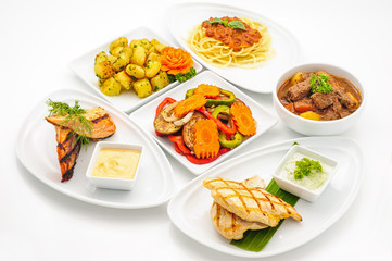 Set of international dishes arranged for catering, studio shot
