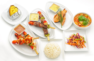 Set of international dishes arranged for catering, studio shot