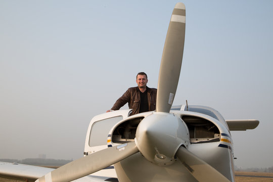 Pilot with the aircraft  after landing.