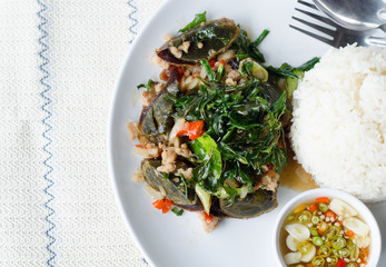 Fried century egg with crispy holy basil