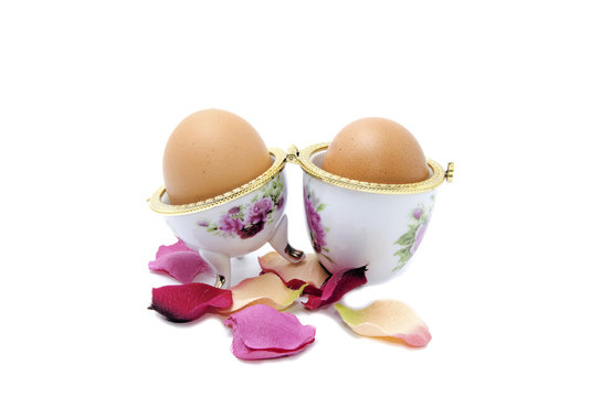 two eggs in porcelain and atificial petals