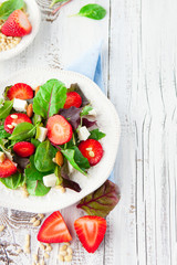Spring salad with spinach leaves