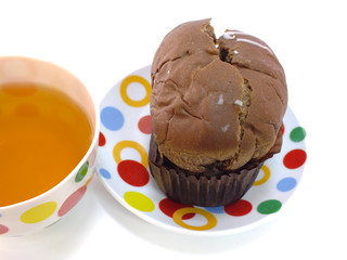 tea and chocolate bread on red tablecloth