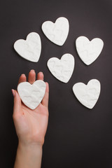 Hand holding little hearts