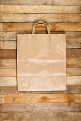 Paper bag on a wooden texture