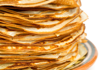 stack of crepes on a plate isolated on white