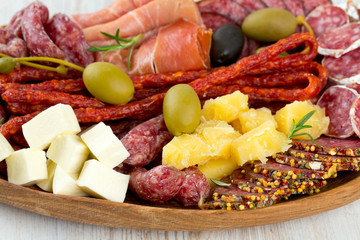 Antipasti and catering platter with different meat and cheese pr