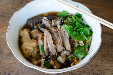 chicken noodle soup with herbs and vegetables, Thai style