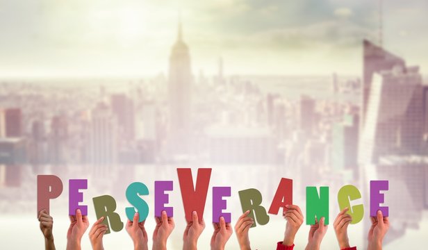 Composite image of hands showing perseverance