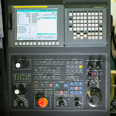 Front view on cnc milling machine control panel with display