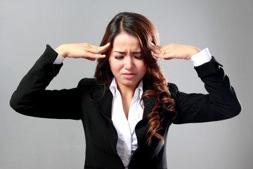 young businesswoman having headache, stress, problem