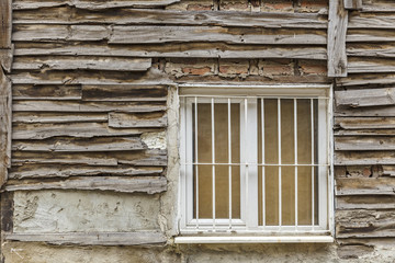 Fototapeta na wymiar Old wooden house wall paneling and window