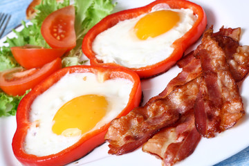 Breakfast fried eggs, bacon, tomatoes and lettuce