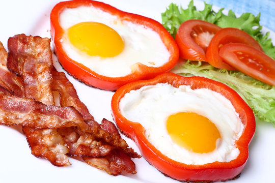 Breakfast fried eggs, bacon, tomatoes and lettuce