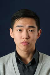 Obraz premium Young Asian man looking at camera