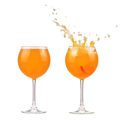 Colorful orange juice make splash in glass isolated on white