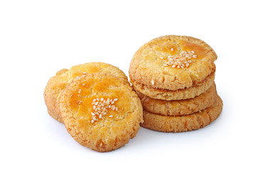 Sweet cookies with sesame seeds isolated on white background