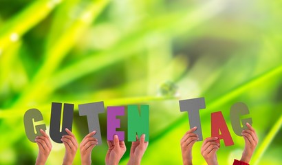 Composite image of hands holding up guten tag