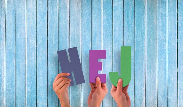 Composite image of hands holding up hej