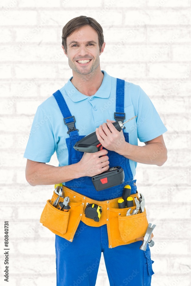 Poster composite image of confident carpenter holding drill machine