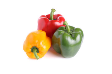 Colored peppers over white background