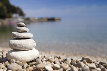 Stack of stones, Zen concept, on sandy beach