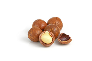 Shelled and unshelled macadamia nuts isolated on white