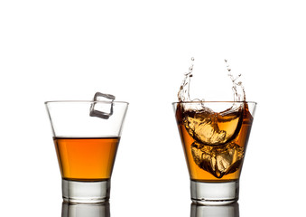 whisky splash in glass isolated on a white