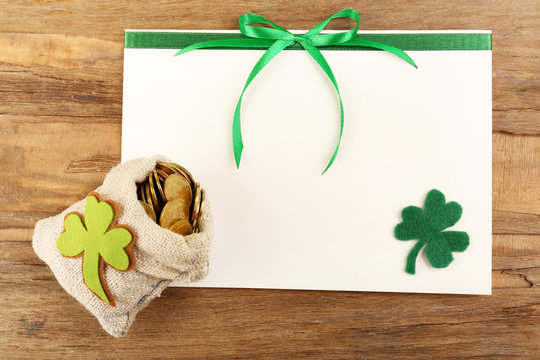 Greeting card for Saint Patrick's Day with bag of coins