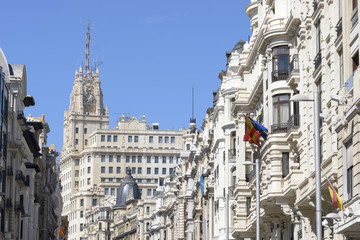 Fototapeta na wymiar Buildings situated on representative Gran Via street, Madrid