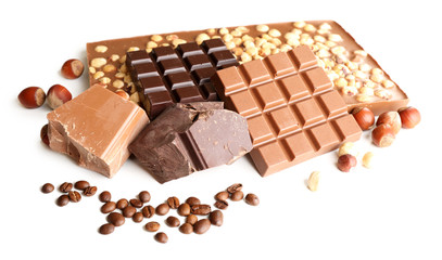 Chocolate bars with hazelnuts and coffee beans isolated on