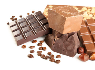 Chocolate bars with hazelnuts and coffee beans isolated on