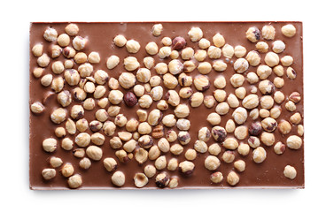 Milk chocolate bar with hazelnuts isolated on white