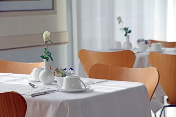 Table for breakfast in white