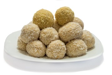 Sweet coconut balls on plate