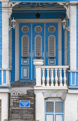 Old wooden house wall paneling and window