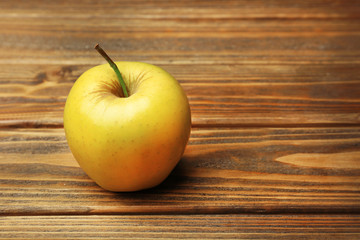 Apple on wooden background