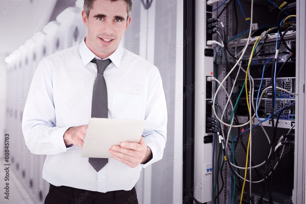 Poster portrait of a businessman with a tablet computer