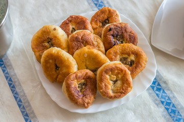 Belyashi - turkmenian pastry with meat on plate