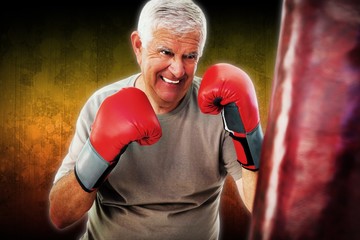 Composite image of portrait of a determined senior boxer