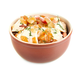 Tasty dumplings with fried onion in brown bowl, isolated