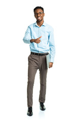 Fototapeta premium Happy african american college student with laptop standing on w