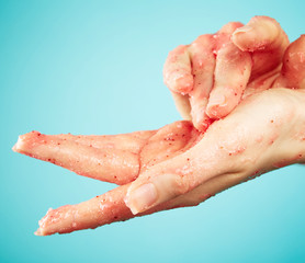 Fototapeta premium Woman's hands in body scrub