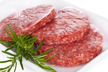 Raw hamburgers.