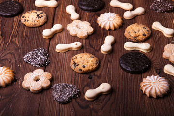 Various cookies on the wooden table