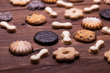 Various cookies on the wooden table