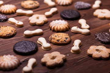 Various cookies on the wooden table