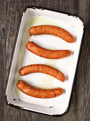 tray of rustic uncooked sausages